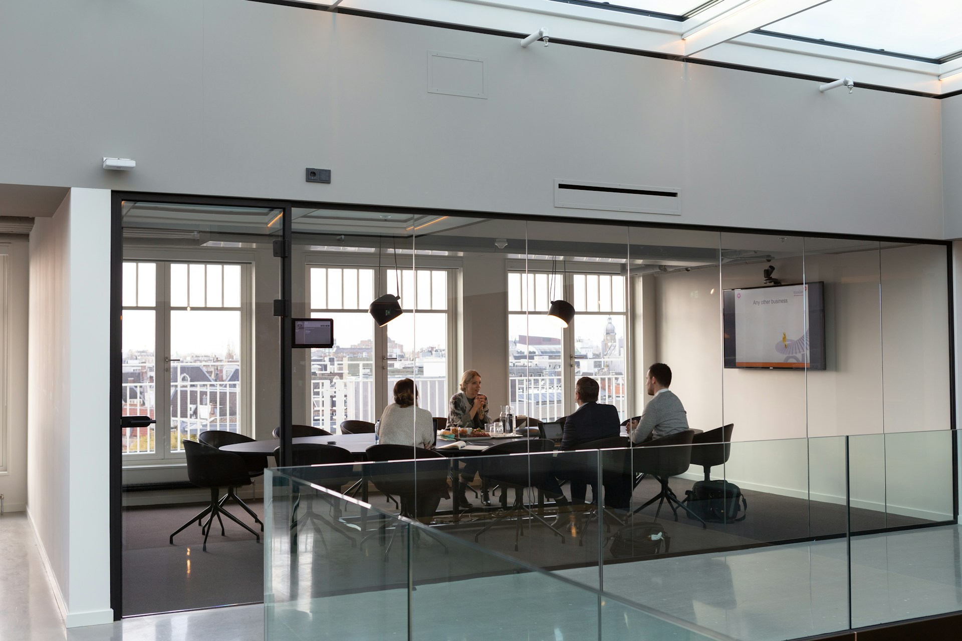 People Having a Business Meeting in a Glass Office